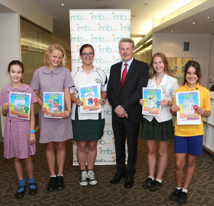 Design An Ad winners: IMB Bank chief executive Robert Ryan (third from right) with winning students Sunday Windsor, Ruby Eckermann, Marley McGee, Madelina Camilleri, and Abigail Esteves. Picture: Greg Ellis.

