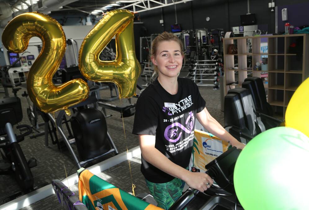 Many feet for cause: Anytime Fitness Shellharbour club manager Taylah O’Brien warms up for this Friday and Saturday's treadmill challenge. Picture: Greg Ellis.


