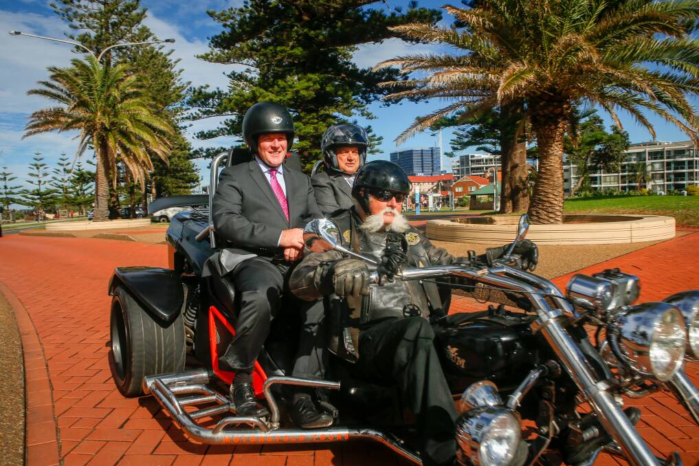 Cruise control: Steve Melchior takes Royal Caribbean's Gavin Smith and Wollongong City Counci's Cr Leigh Colacino for a ride in Lang Park. Picture: Adam McLean.
