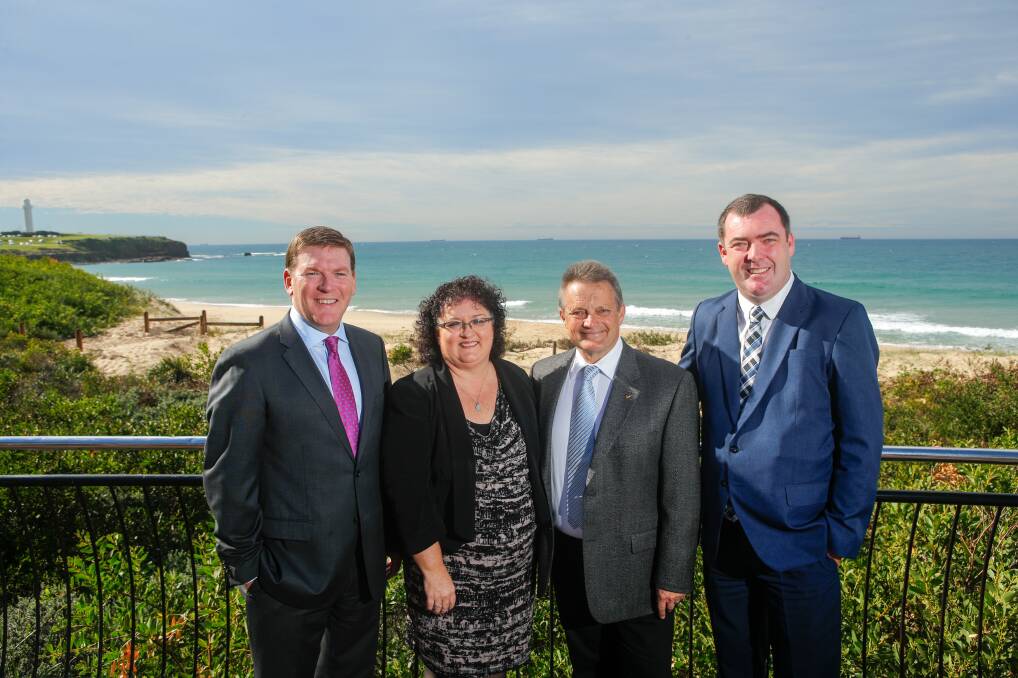 World class destination: Gavin Smith, Tania Brown, Leigh Colacino and Mark Sleigh in front of one of the good vantage points to watch Radiance of the Seas come into Port Kembla from on October 30. The large cruise ship with 2400 passengers will come up past the Five Islands from the south before turning around to come into Port Kembla from the north not long after dawn. 