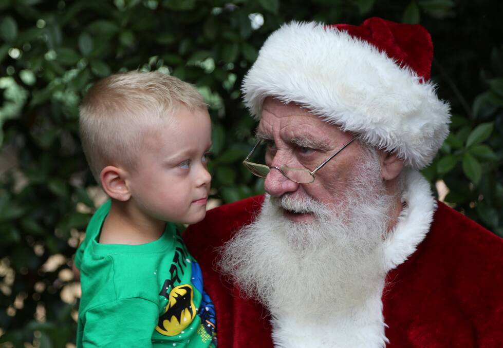 I would like a....: Logan Cutajar tells Santa how good he has been this year. Picture: Greg Ellis.

