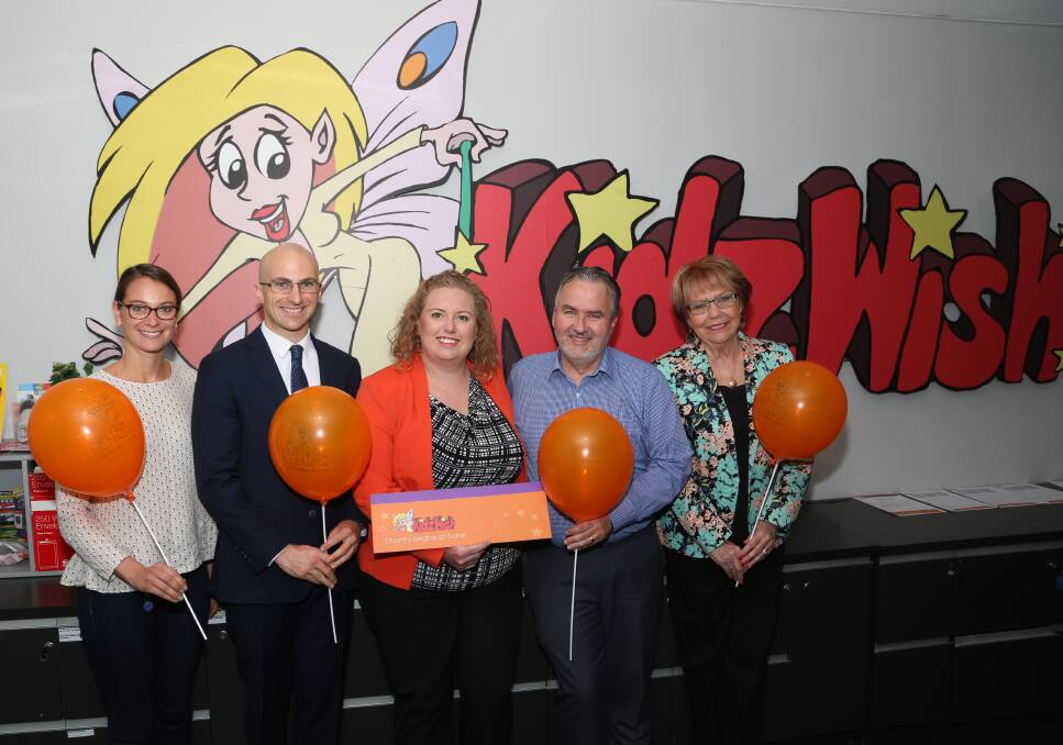 Giving back to kids: Sponsors Julie Gesnel from Stockland Shellharbour from Stockland Shellharbour, Kevin McDonald of Finance Control, Sandra Greaves from McDonalds Illawarra and Steve Chlopicki representing QBE Foundation are thanked by Chris Beaven at KidzWish HQ. Picture: Greg Ellis.



