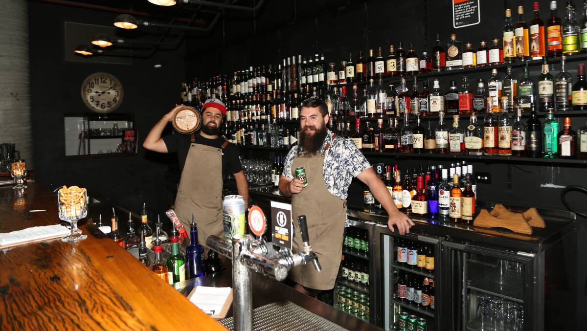 Whisky, beer, beards and cocktails: Ben Abraham and Luke Symons who, with their friend Scott Mileto, are the new owners at Howlin' Wolf Bar in Wollongong. Picture: Greg Ellis



