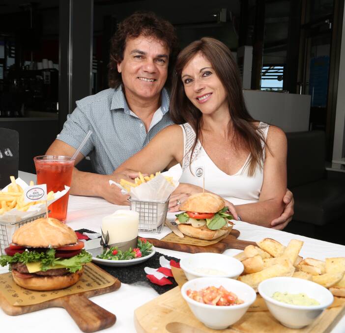 Mr and Mrs McDonalds: Glenn and Katia Dwarte are rolling out two and three course meals with table service at McDonalds Warilla for couples and families on Valentine's Day. Picture: Greg Ellis.