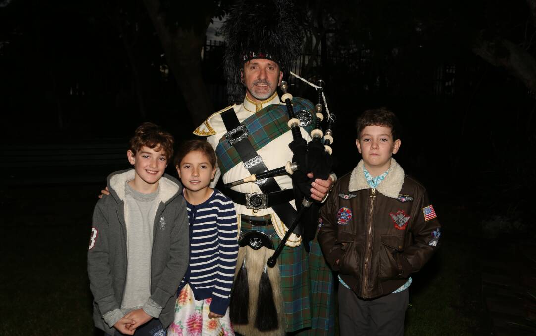 Generations remember: Harley, Megan, Christopher and Cameron Adams at the Thirroul dawn service. Picture: Greg Ellis.
 