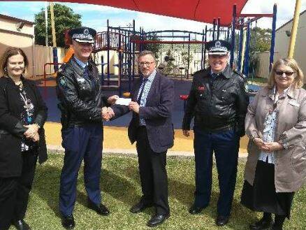 Funding support? ASPECT South Coast School principal Bruce Rowles with Assistant Commissioner Peter Barrie and Chief Inspector Bryan Rugg.
