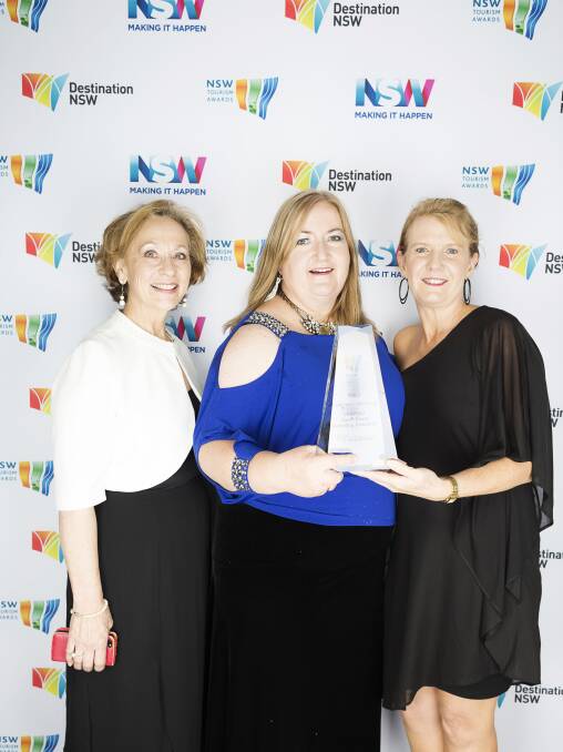 TOURISM WINNERS: Eurobodalla Tourism’s Kerrie-Anne Benton, South Coast RTO chair Catherine Shields and secretary Diane Johnston accept the Gold Award for the “Unspoilt campaign” in Sydney on Friday night. Picture supplied.

