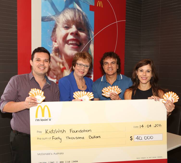 Helping hand: Elder Ornelas, Chris Beaven and Glenn and Katia Dwarte celebrate $40,000 being raised for KidzWish at McDonalds stores. Picture: Greg Ellis.
