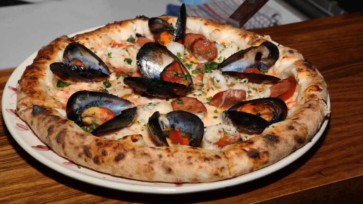 The Gong Pizza: Made with napoli sauze, mozzarella, chorizo, mussels, garlic prawns and a mozzarella crust. Picture: Greg Ellis.

