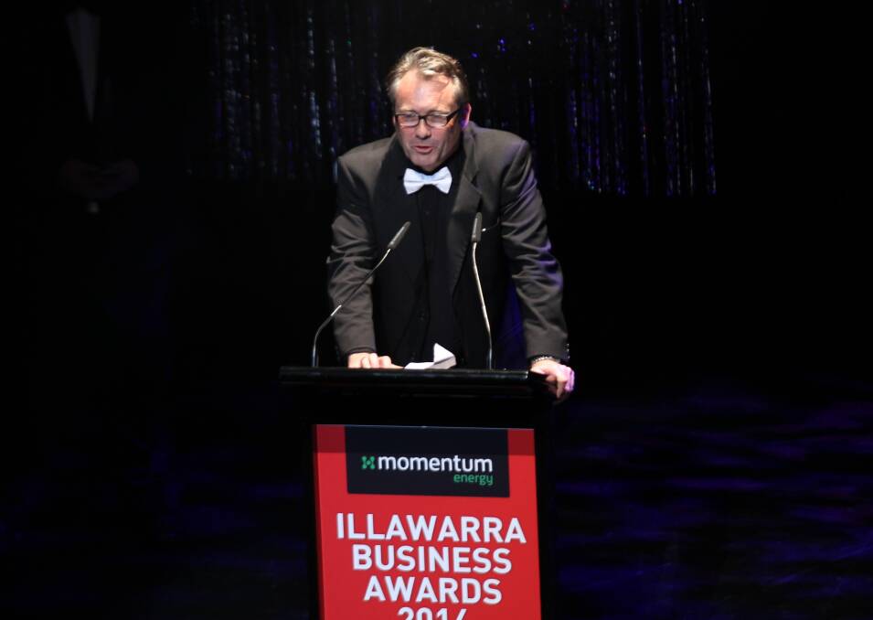 RMB Lawyers managing partner Craig Osborne accepting the 2014 Illawarra Business Award for business excellence. Picture by Greg Ellis.