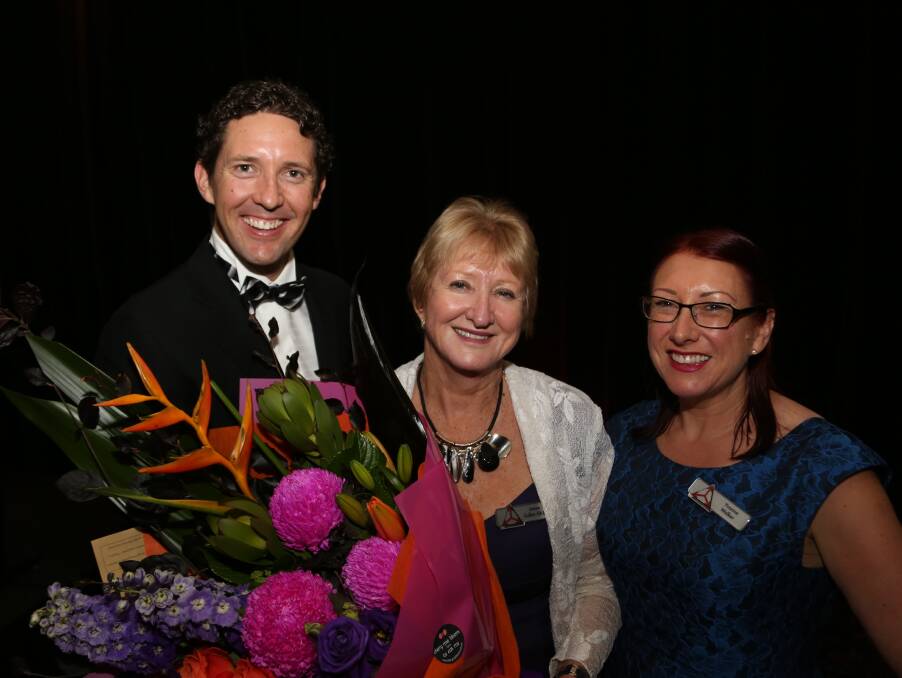 Bouquet thank you: Peter Buckley, Janine Cullen and Yvonne Walker following Mrs Cullen's decision to step down as a director. Picture: Greg Ellis.
