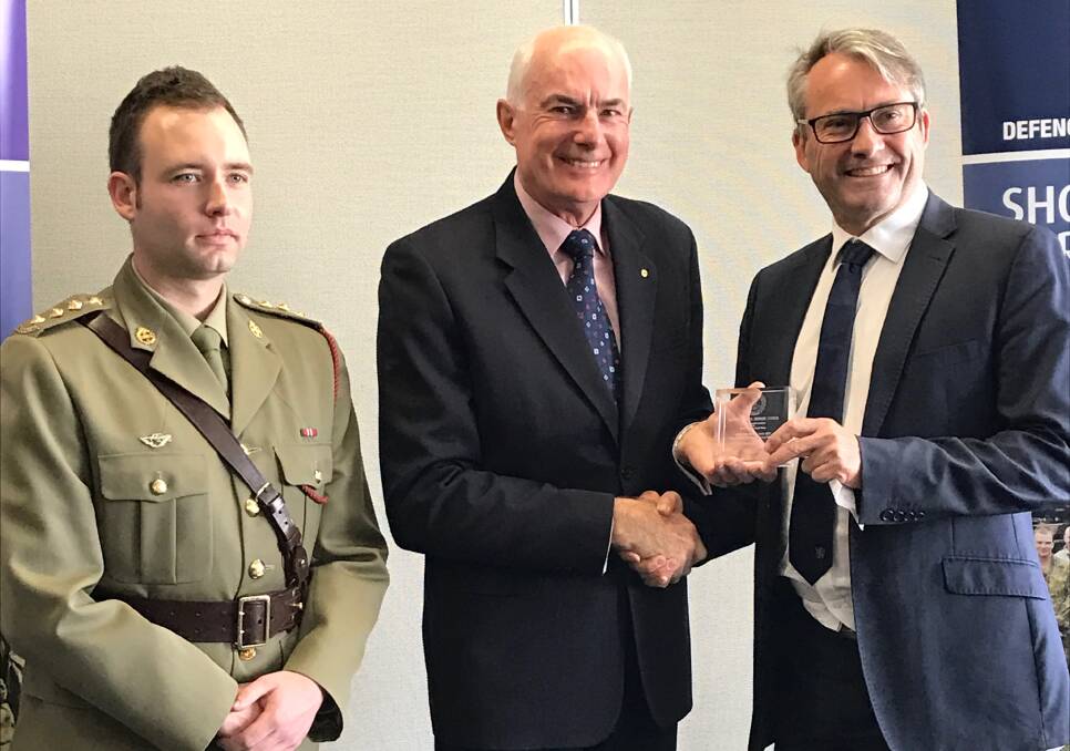 Law firm defence recognition: Captain Stacy Ford, ACT & NSW chair Mr Philip Moss and RMB Lawyers managing partner Craig Osbourne,
