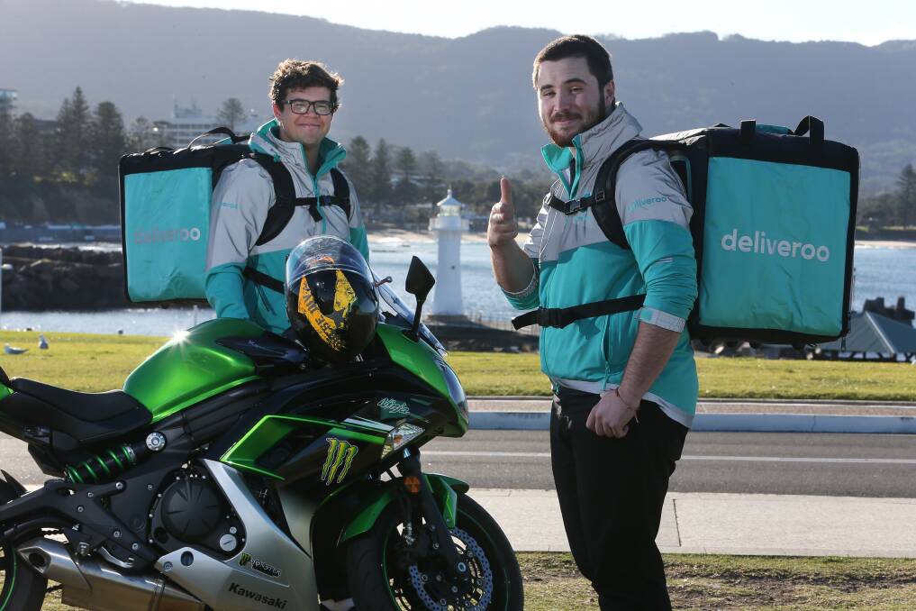 Meals delivered in 30 minutes: Tyson Williams and Troy McMullan prepare to get busy as Deliveroo officially starts its delivery service from Wollongong restaurants on Thursday. Picture: Robert Peet
