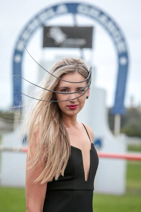STYLE THE REAL WINNER: Whitney Hadfield wearing a Terence Gregory fascinator on the finish line at Kembla Grange Racecourse. Picture Adam McLean.