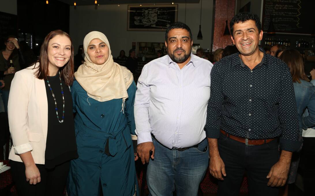 Refugees share their stories: SCARF's Sophie-May Kerr with volunteers Ghada Al Hussein, Ahmad Al Taleb and Burhan Zangana at the University of Wollongong. Picture: Greg Ellis.