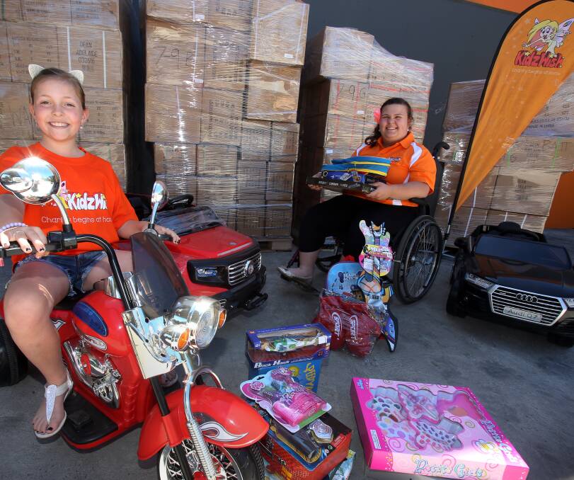 KidzWish ambassadors: Lahnee Attwell and Samantha Atkin with some of the toys for the 2016 Christmas Party at the WEC. Picture: Robert Peet
