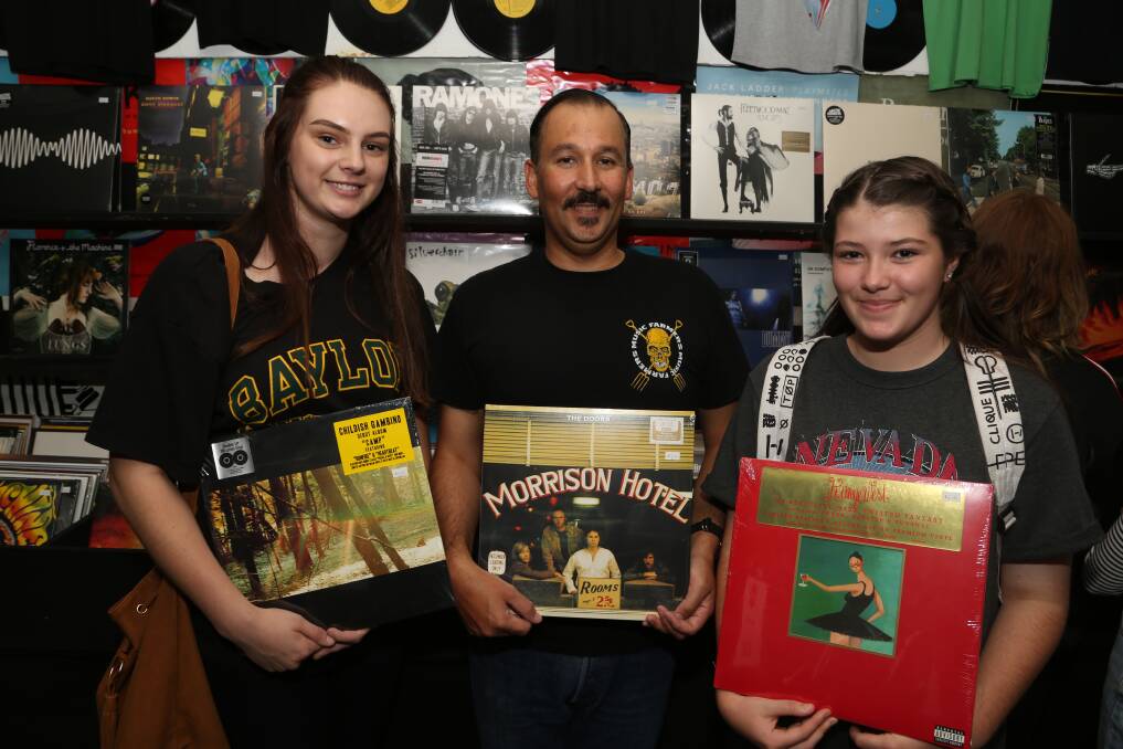 Record Store Day: Jasmine Flood with Music Farmers co-owner Nick Irwin and Jordan Lachlan. Picture: Greg Ellis. 
