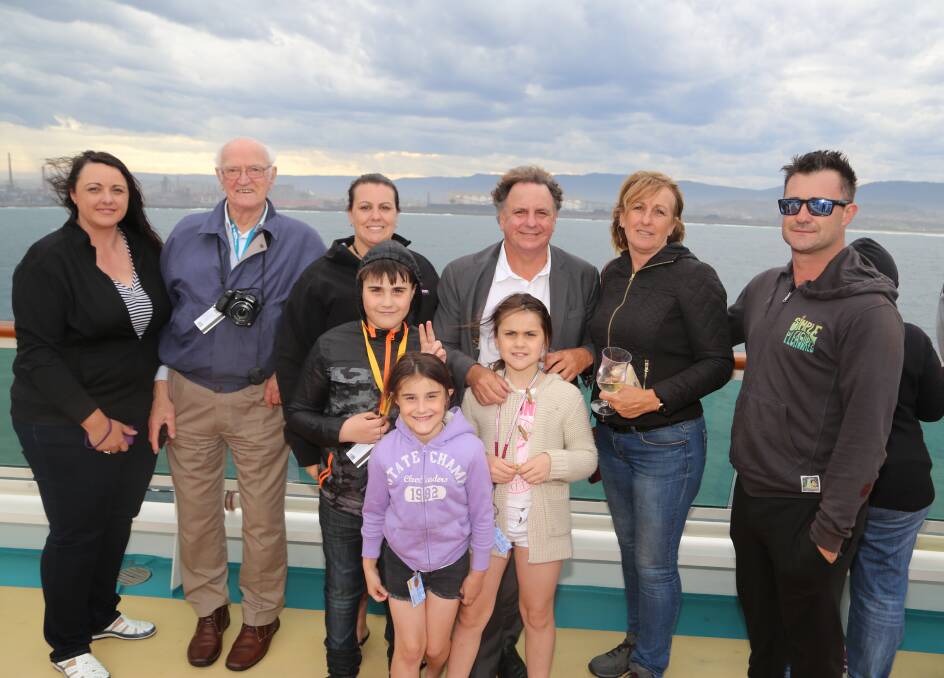 Reflecting: John King and his family reflecting on a great day as they sail out of the Wollongong on Radiance of the Seas. Picture: Greg Ellis.


