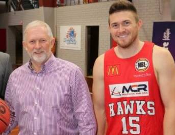 Training with the stars: Peoplecare chief executive Michael Bassingthwaighte at the Snakepit with Illawarra Hawks star Rotnei Clarke. Picture: Greg Ellis.
