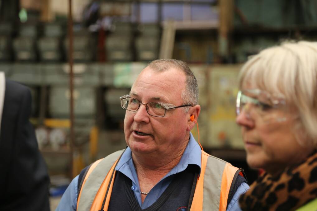 Leading edge: Klondu Group  Fabrication Shop manager Ian O’Brien explains some of the diverse work 90 personnel do at the large Port Kembla facility.


