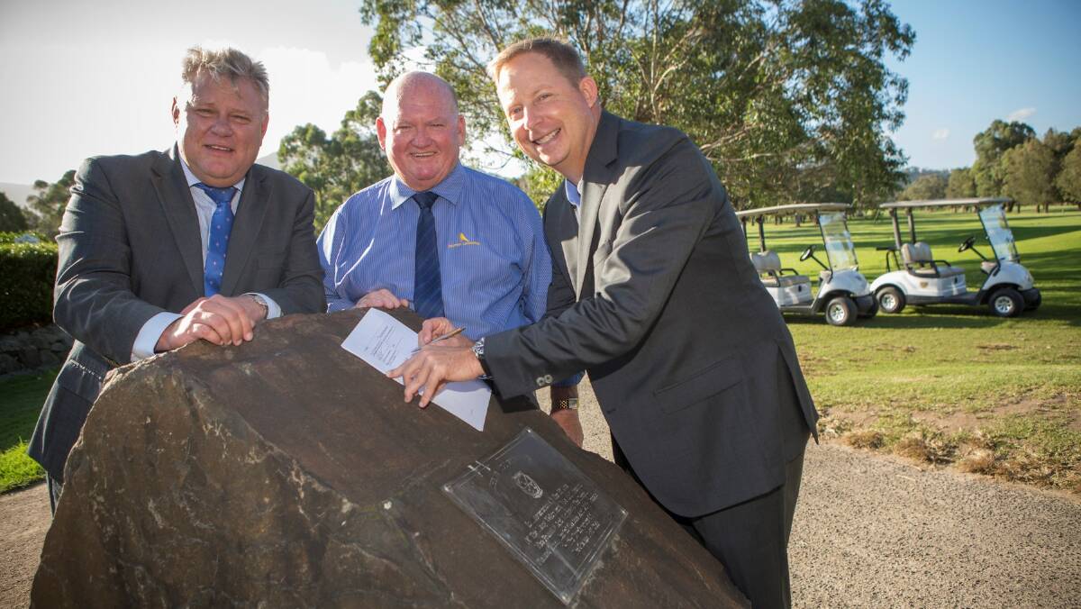 Signing $7 million upgrade deal: Bruce Glasco (Chief operating officer and managing director of Troon’s International Division on the right) signs the contract with David Hiscox (CEO of Dapto Leagues on the left) and Gary Tozer (club president of Dapto Leagues and The Grange in the centre). Picture supplied.

