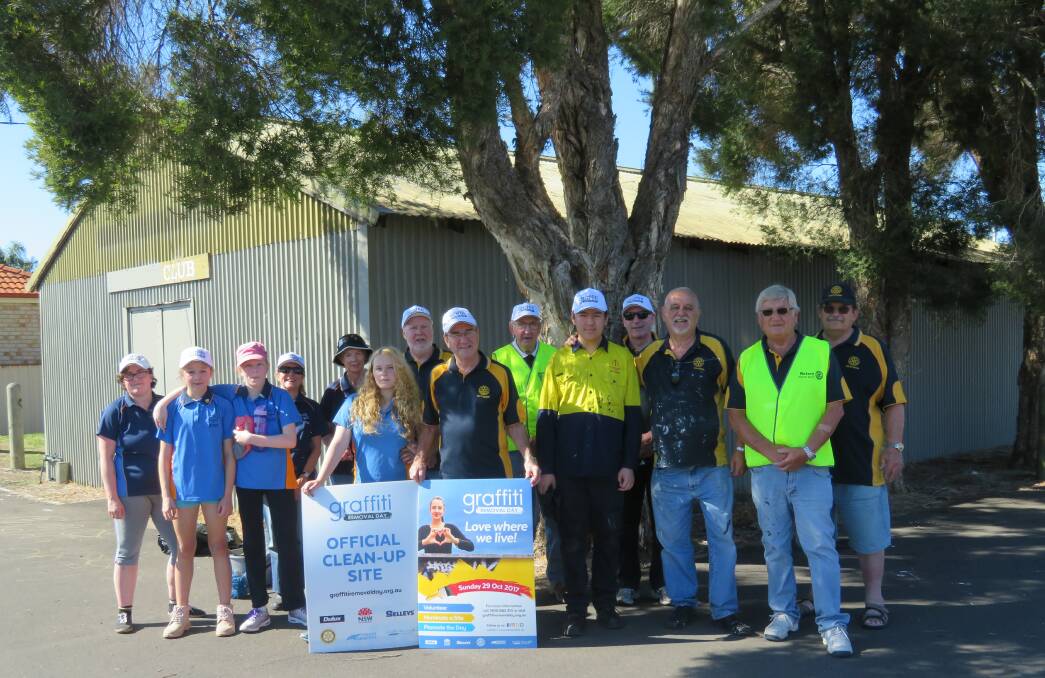 Community service: Graffiti Removal Day participants at Unanderra on Sunday the morning after Rotary celebrated 90 years of service in the Illawarra.
