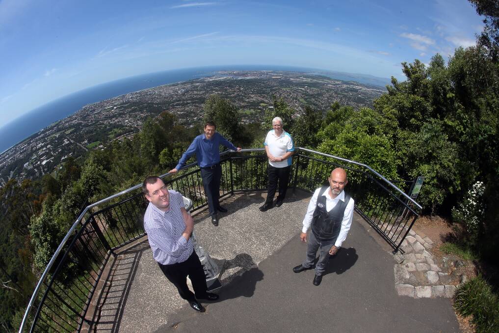 GRAND SHIP VISION: Tourism boss Mark Sleigh, of Destination Wollongong, and cruise expert Toby Biddick, of Abercrombie and Kent, at Mt Keira Lookout with tourism operators Ron Robinson, of South Coast Senic Tours, and Barry Roberts, of Just Looking Trike Tours, overlooking Mt Keira exactly one year before the arrival of Royal Caribbean's Radiance of the Seas. Picture: Robert Peet