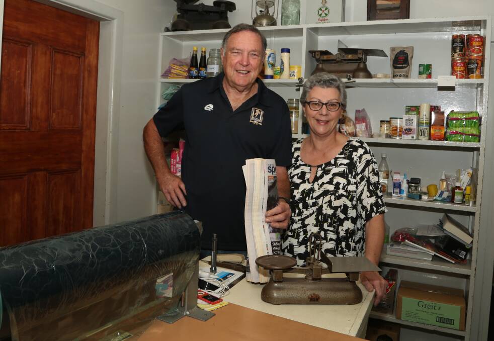 End of an era: Merv and Di Boatswain in the former shop section of their Mount Kembla home where they wrapped and delivered newspapers from 2.30 every morning for 35 years. Picture: Greg Ellis.

