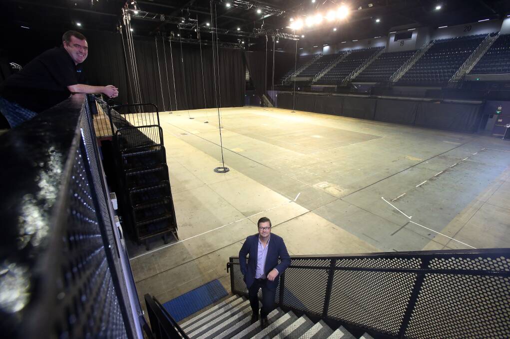 Venue: Desination Wollongong's Mark Sleigh & WIN Sports & Entertainment Centre's Marc Swan with the surface being repainted at WIN Entertainment Centre. Pic: Robert Peet
