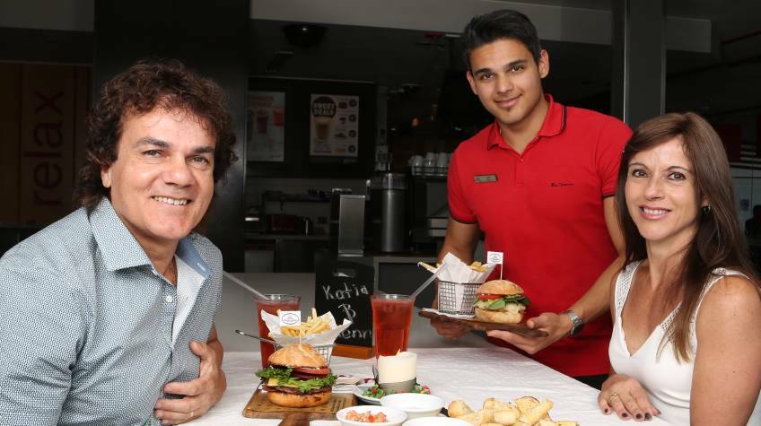 Sell out: Glenn, John and Katia Dwarte have received so much interest they are doing another McLove dinner on Valentine's Day at McDonald's Warilla. Picture: Greg Ellis.

