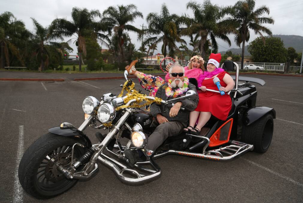 Surprise: Steve Melchior and Bianca Dye played Mr and Mrs Claus for Ashleigh Fiorio with a three-wheeled sleigh that ran on horsepower, not deerpower. Picture: Greg Ellis. 