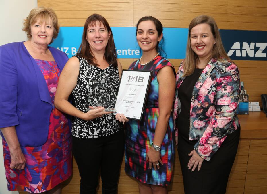 And the winner is: Illawarra Women In Business director Glenda Papac with Simone Campbell and her community award with judges Adele Hanna and Ioanna Alexopoulos . Picture: Greg Ellis.
