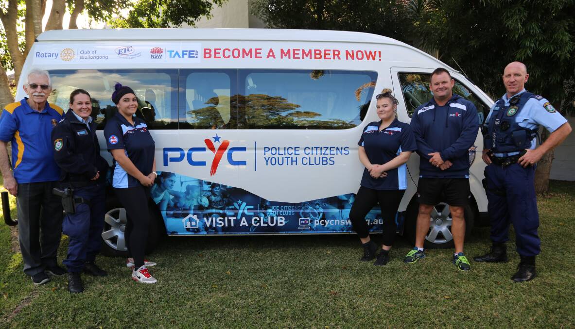 New wheels: Wollongong Rotary Club president Leigh Robinson and Snr Const Cate Johnston with Blue Star Citizenship Program participants Tayah Spears and Tamika Burgess, PCYC manager Michael Jones, Snr Const Darren Palk. Picture: Greg Ellis.
