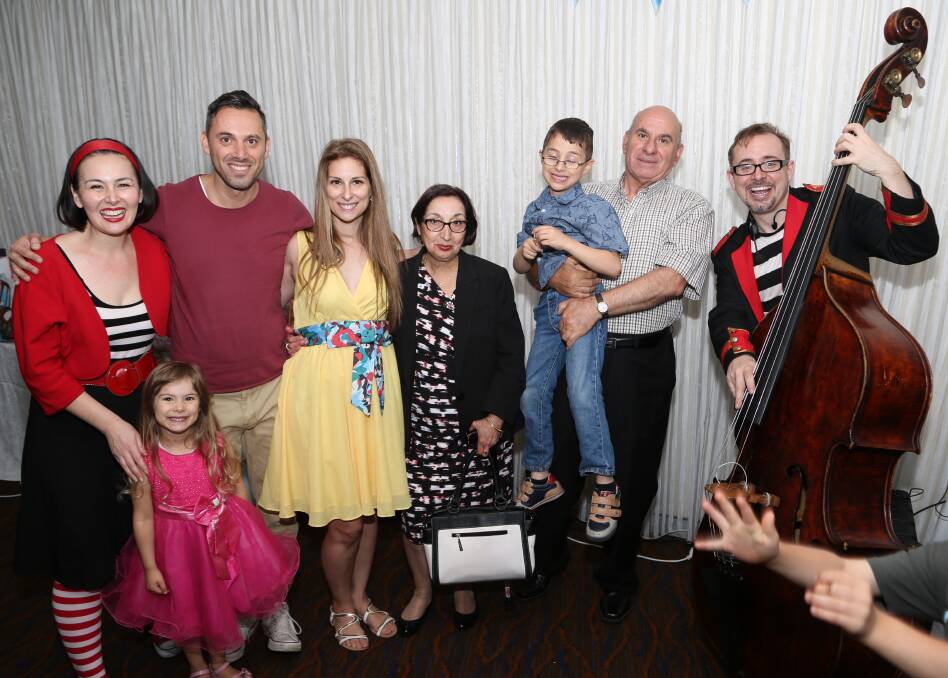 BIG BAND BIRTHDAY: The Nicolaou family with Lah-Lah and Buzz The Band Leader and Lola the double bass. Picture: Greg Ellis.