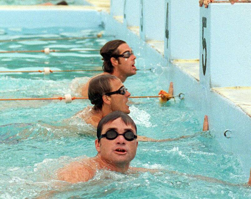 An inspiration to others: Jonathan Crowe with Dean Mercer and Darren Mercer having a relay with some juniors in the Wollongong Continental Baths in 1998.
