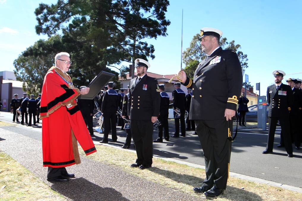 Ceremony: Presentation of the scroll to the crew of HMAS Wollongong at MacCabe Park on Sunday. Picture: Sylvia Liber.


