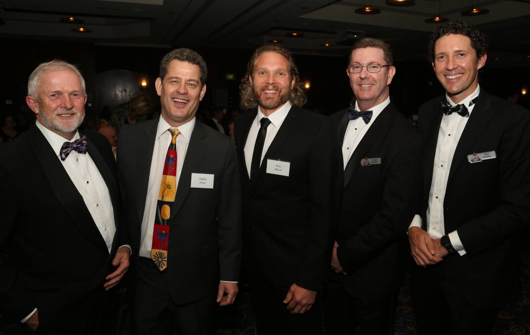 Congratulations: Michael Bassingthwaighte, Professor Charles Areni and Tory Macri with TIC president Graham Lancaster and Peter Buckley. Picture: Greg Ellis.


