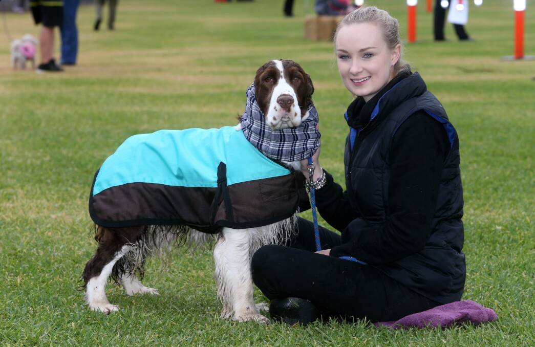 Shellharbour winner: Perky Pooches founder Tiarne Perkiss with Bond at the Dogs Day Out event at Black Beach Kiama recently. Picture: Robert Peet.

