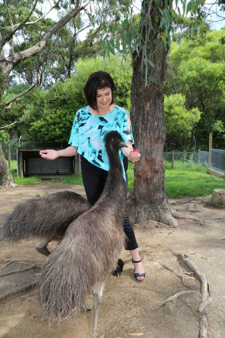Nieves Murray and a new emu friend.