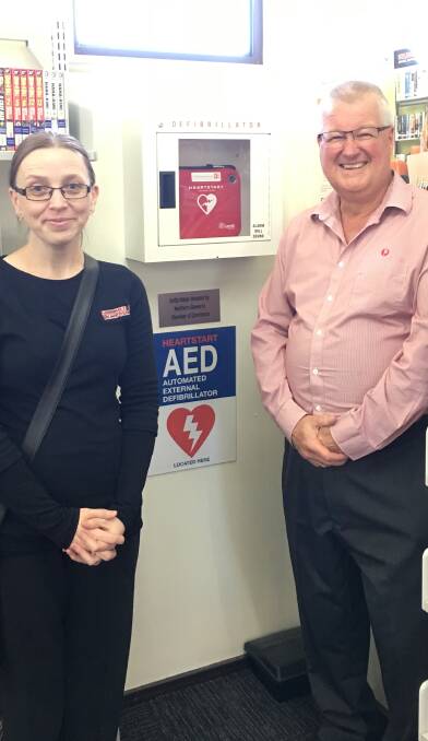 First-response care: Northern Illawarra Chamber vice president Tanya Parry and president Greg Watts with one of the new defibrillators. Pictures: Supplied.