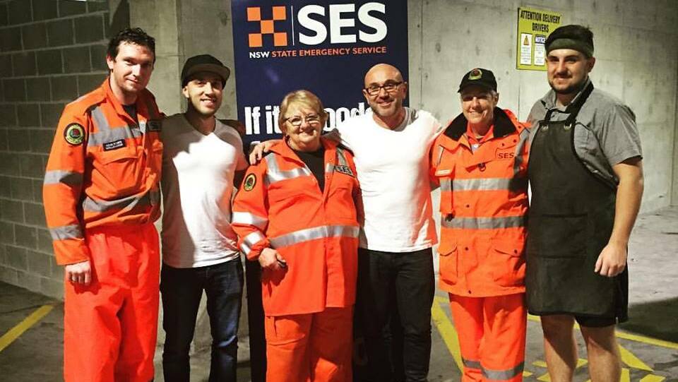 Helping helpers: Allen Markovsk (2nd left) & Lube Markovski (3rd right) and the team at Grill'd Wollongong provided sustenance to hungry SES volunteers.

