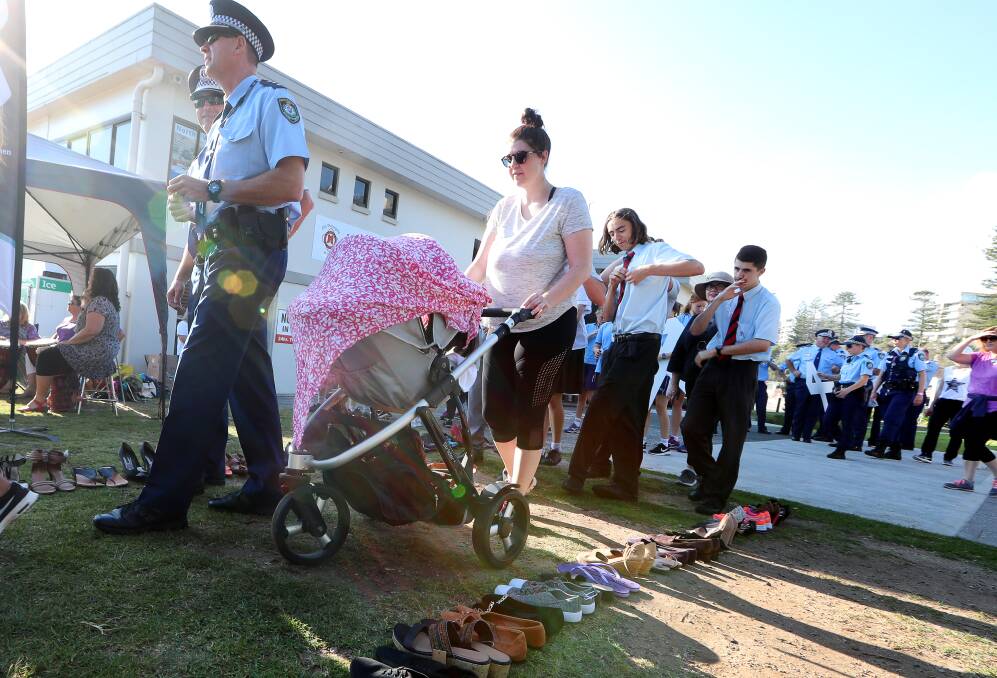 Big turnout: Police, parents and school children were among the hundreds of walkers against domestic violence. Pictures: Sylvia Liber.
