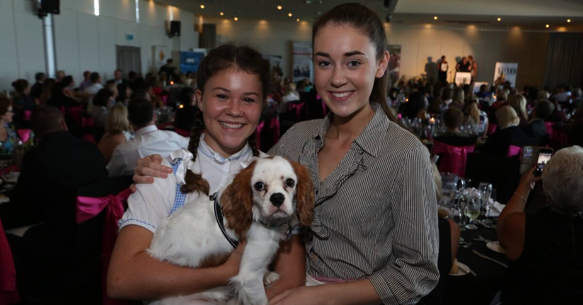 A Star Is Born: TIGS students Lucinda Paine & Darcy Fisher with dog star Comet after their Wizard of Oz performance at the IWIB Awards. Picture: Greg Ellis.



