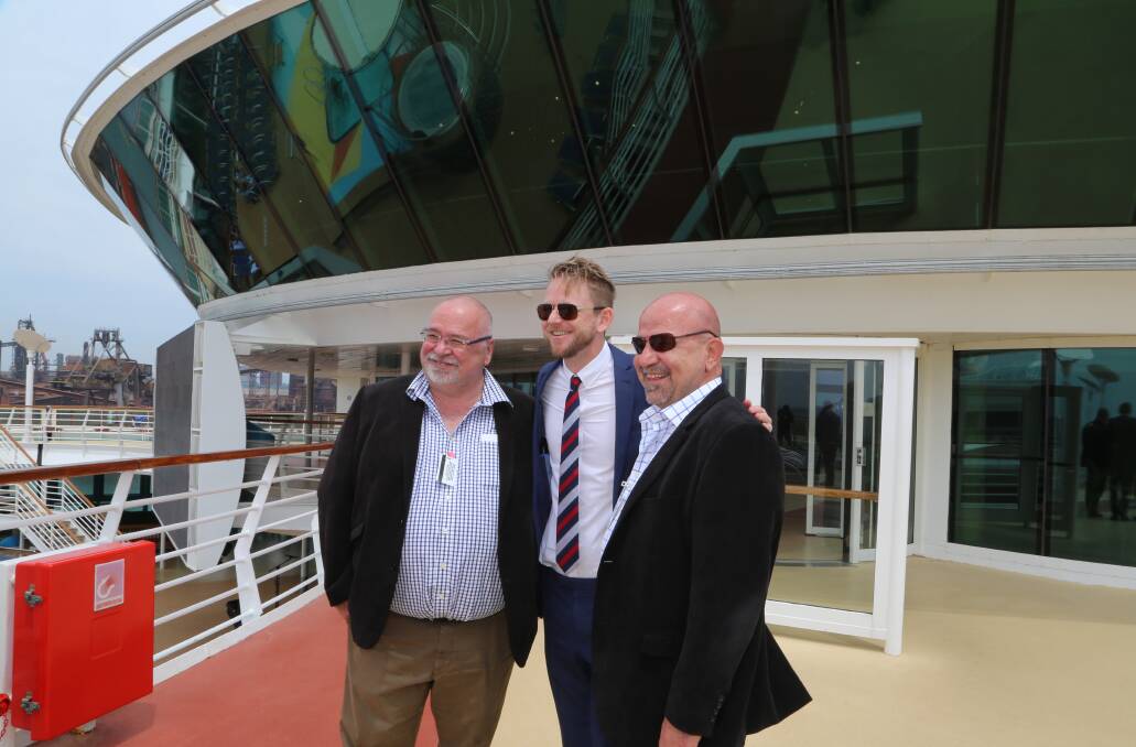 PORT KEMBLA POTENTIAL: Tas Kollaras, Adam Armstrong and Michael Kollaras on the upper pool deck of Radiance of the Seas when the Royal Caribbean ship made the cruise industry's maiden voyage to Wollongong in October 2016. Picture: Greg Ellis.
