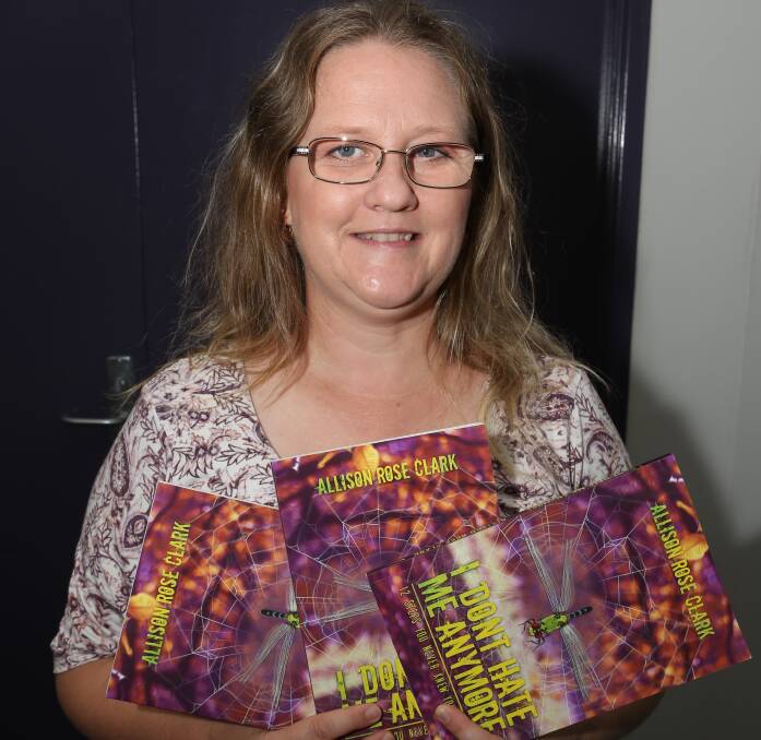 LAUNCHED:  Wollongong author Allison Rose Clark with her newly-published self-help memoir I Don't Hate Me Anymore.
