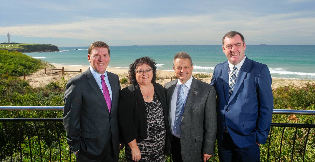 Ready for giant visitor: Gavin Smith, Tania Brown, Leigh Colacino and Mark Sleigh at City Beach which will provide one of the best views from Wollongong.
