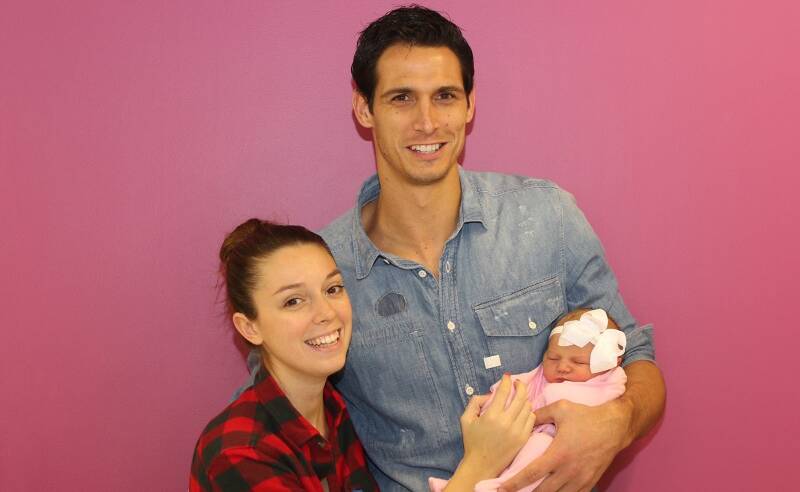 PRETTY IN PINK: Illawarra Hawks co-captain Oscar Forman and his Italian partner Gaia Ferrari with their daughter Olivia Charlotte. Picture: Joel Armstrong. 