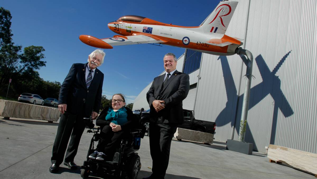 ON A HIGH: Rotary Club of Wollongong president Leigh Robinson, Melinda Montgomery from Essential Employment and Training and Mark Bright from Wings over Illawarra at the HARS museum function. Photo: Adam McLean.
