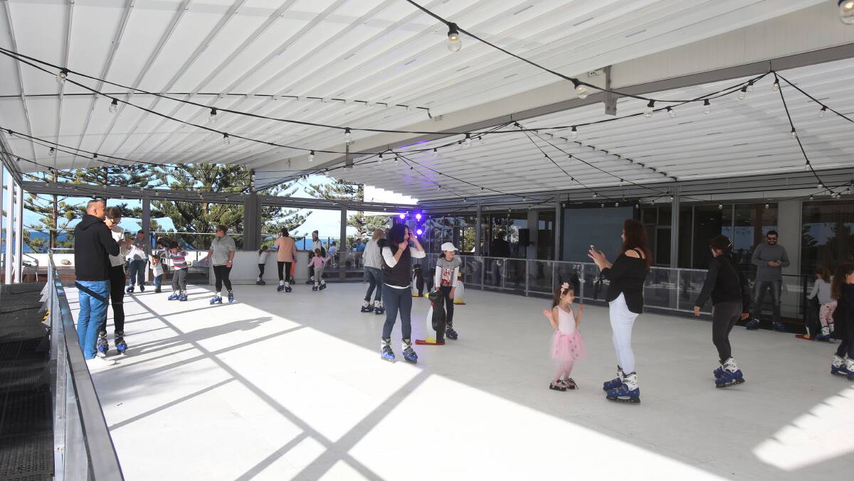 WINTER WONDERLAND: People get their skates on from the balcony of the Novotel Northbeach. Picture: Robert Peet. 