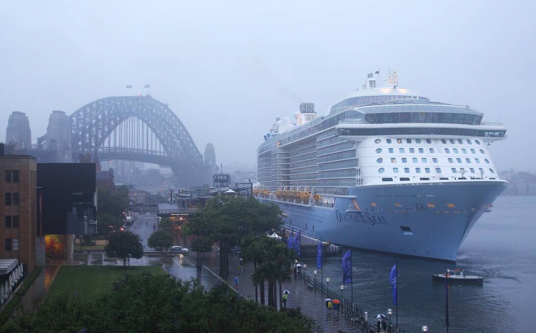 MOTHER SHIP: The Ovation of the Seas  looming large in Circular Quay after berthing in Sydney Harbour on Thursday morning. Picture: Getty Images.